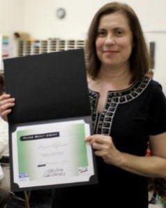 Margot Heffernan accepts the Tutor Merit Award from the Skyline Literacy Coalition